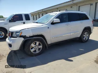 2011 Jeep Grand Cherokee Laredo z VIN 1J4RR4GG6BC617616, wystawiony jako Copart lot #56165735 z przebiegiem 216 476 mil mil oraz Szkoda całkowita • Salvage title. Historia ofert i sprzedaży dostępna na DreamBid. Obrazek 1.