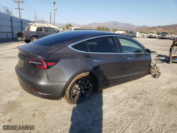 2020 Tesla Model 3 Standard Range Plus with VIN 5YJ3E1EA7LF803660, listed as a Copart auction lot 77394564 with 61,062 mi miles and Salvage Title. Bid and sale history available at carsss.com. Image 3.
