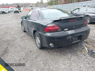 2004 Pontiac Grand Am GT with VIN 1G2NW52E84M651292, listed as a IAAI auction lot 41726143 with 137,296 mi miles. Bid and sale history available at carsss.com. Image 3.