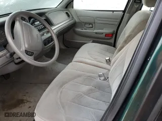 2000 Ford Crown Victoria with VIN 2FAFP73WXYX157746, listed as a Copart auction lot 82748804 with 56,820 mi miles and Salvage Title. Bid and sale history available at carsss.com. Image 7.