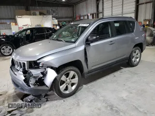 2016 Jeep Compass Sport with VIN 1C4NJCBA1GD512864, listed as a Copart auction lot 56297115 with 216,693 mi miles and Salvage title. Bid and sale history available at DreamBid. Image 1.