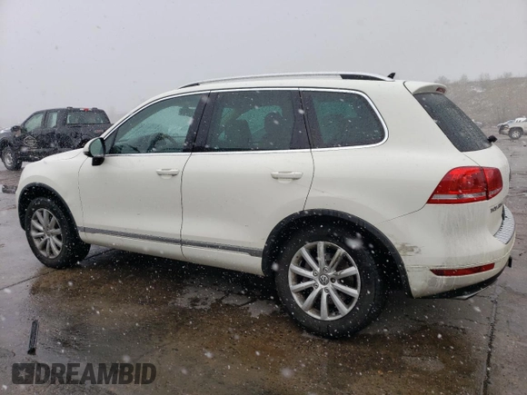 2011 Volkswagen Touareg Sport with VIN WVGFF9BP8BD002982, listed as a Copart auction lot 53958555 with 156,742 mi miles and Salvage Title. Bid and sale history available at DreamBid. Image 2.