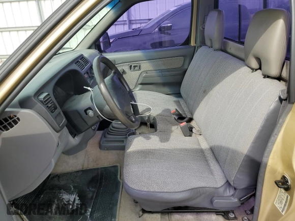 1999 Nissan Frontier XE with VIN 1N6DD21S9XC312809, listed as a Copart auction lot 57702005 with 174,183 mi miles and Clean title. Bid and sale history available at DreamBid. Image 7.