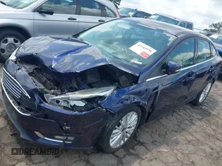 2016 Ford Focus Titanium z VIN 1FADP3J20GL208439, wystawiony jako IAAI lot #42145938 z przebiegiem 135 522 mil mil oraz . Historia ofert i sprzedaży dostępna na DreamBid. Obrazek 18.
