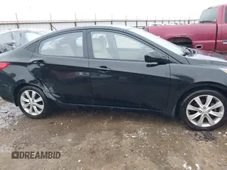 2013 Hyundai Accent GLS with VIN KMHCU4AE9DU379870, listed as a IAAI auction lot 41534029 with 102,610 mi miles. Bid and sale history available at carsss.com. Image 13.
