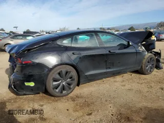 2023 Tesla Model S with VIN 5YJSA1E57PF507456, listed as a Copart auction lot 44649945 with 8,760 mi miles and Salvage title. Bid and sale history available at DreamBid. Image 3.