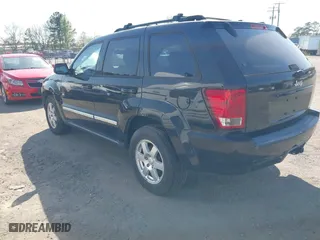 2010 Jeep Grand Cherokee Laredo with VIN 1J4PR4GK5AC120373, listed as a IAAI auction lot 42071835 with 101,949 mi miles. Bid and sale history available at carsss.com. Image 3.