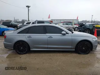 2016 Audi A6 2.0T Premium Plus with VIN WAUGFAFC1GN014536, listed as a IAAI auction lot 41937616 with 122,417 mi miles. Bid and sale history available at carsss.com. Image 13.