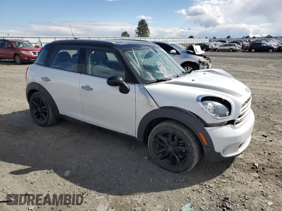 2015 MINI Countryman with VIN WMWZB3C50FWR44801, listed as a Copart auction lot 51957715 with 69,537 mi miles and Salvage Title. Bid and sale history available at DreamBid. Image 4.