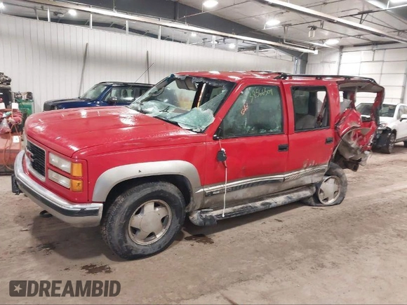 1999 GMC Suburban z VIN 1GKFK16R2XJ759130, wystawiony jako IAAI lot #40250336 z przebiegiem 235 141 mil mil oraz . Historia ofert i sprzedaży dostępna na DreamBid. Obrazek 2.