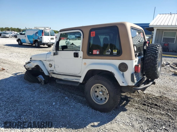 2000 Jeep Wrangler Sahara with VIN 1J4FA59SXYP764539, listed as a Copart auction lot 52707385 with 136,159 mi miles and Salvage title. Bid and sale history available at DreamBid. Image 2.