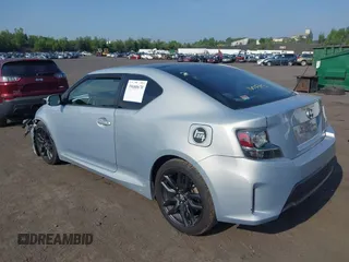 2014 Scion tC with VIN JTKJF5C78E3072572, listed as a IAAI auction lot 39680670 with 112,584 mi miles. Bid and sale history available at carsss.com. Image 3.
