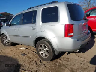 2009 Honda Pilot Touring with VIN 5FNYF48979B008851, listed as a IAAI auction lot 41252736 with 183,292 mi miles and . Bid and sale history available at carsss.com. Image 3.