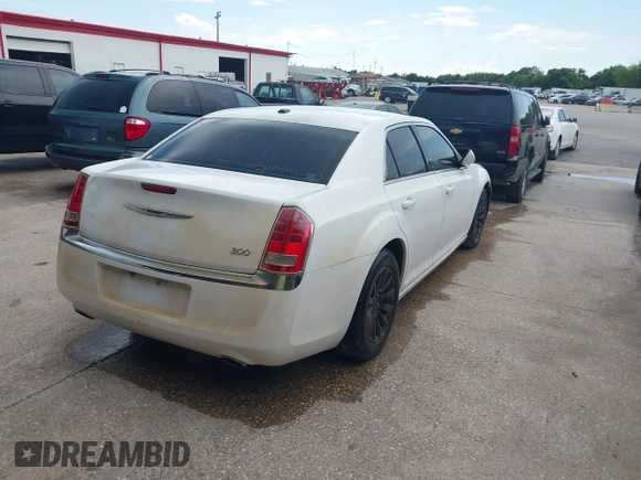2013 Chrysler 300 with VIN 2C3CCAAG9DH588198, listed as a IAAI auction lot 42556294 with 171,765 mi miles and . Bid and sale history available at DreamBid. Image 4.