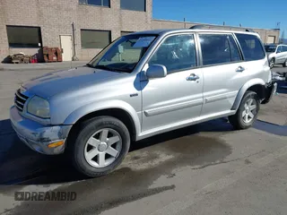 2003 Suzuki XL7 Touring z VIN JS3TX92V734114162, wystawiony jako IAAI lot #41250622 z przebiegiem 227 494 mil mil oraz . Historia ofert i sprzedaży dostępna na DreamBid. Obrazek 2.