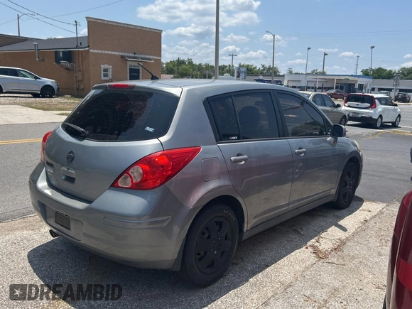 2009 Nissan Versa S with VIN 3N1BC13E19L499018, listed as a Copart auction lot 56711385 with 196,451 mi miles and Clean Title. Bid and sale history available at DreamBid. Image 4.