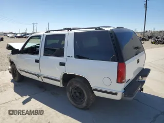 1999 GMC Yukon with VIN 1GKEC13R4XJ809507, listed as a Copart auction lot 50922655 with 227,923 mi miles and Salvage Title. Bid and sale history available at carsss.com. Image 2.