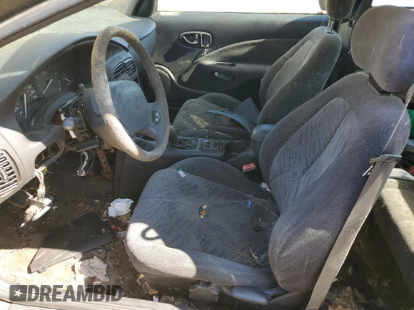 2001 Saturn SC z VIN 1G8ZR12781Z311096, wystawiony jako Copart lot #60574014 z przebiegiem Nie podano mil oraz Tytuł czysty. Historia ofert i sprzedaży dostępna na DreamBid. Obrazek 7.