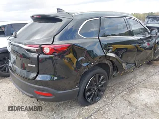 2022 Mazda CX-9 Touring Plus z VIN JM3TCBAYXN0613830, wystawiony jako IAAI lot #41942849 z przebiegiem 50 193 mil mil oraz . Historia ofert i sprzedaży dostępna na DreamBid. Obrazek 4.