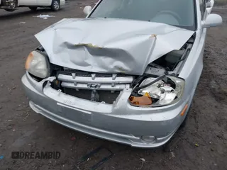 2005 Hyundai Accent GLS with VIN KMHCG35C25U359293, listed as a IAAI auction lot 41233474 with 148,344 mi miles. Bid and sale history available at carsss.com. Image 6.