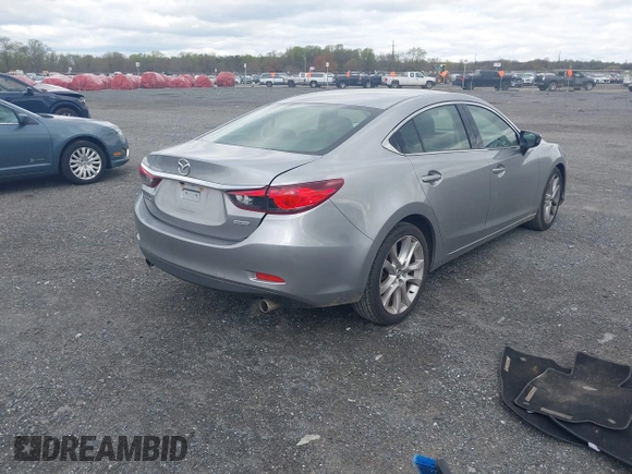 2014 Mazda 6 i Touring with VIN JM1GJ1V64E1147549, listed as a IAAI auction lot 42041025 with 124,400 mi miles and . Bid and sale history available at DreamBid. Image 4.