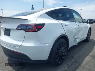 2022 Tesla Model Y Performance with VIN 7SAYGDEF8NF407109, listed as a IAAI auction lot 42014282 with 24,937 mi miles and . Bid and sale history available at DreamBid. Image 4.
