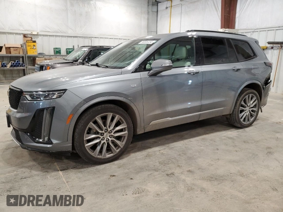 2020 Cadillac XT6 AWD Sport with VIN 1GYKPGRS5LZ145966, listed as a Copart auction lot 66585334 with 76,735 mi miles and Salvage Title. Bid and sale history available at carsss.com. Image 1.