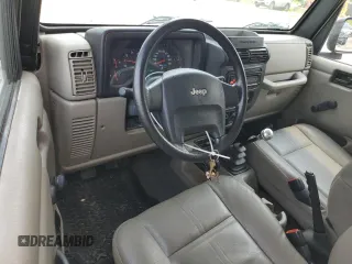 2004 Jeep Wrangler SE with VIN 1J4FA29164P797604, listed as a Copart auction lot 59978155 with 166,888 mi miles and Clean title. Bid and sale history available at DreamBid. Image 8.