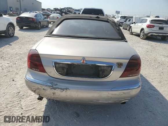 2002 Lincoln Continental with VIN 1LNHM97V32Y647800, listed as a Copart auction lot 75240874 with 71,689 mi miles and Salvage Title. Bid and sale history available at carsss.com. Image 6.