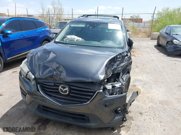 2016 Mazda CX-5 Grand Touring with VIN JM3KE4DY7G0643643, listed as a IAAI auction lot 42077497 with 120,343 mi miles. Bid and sale history available at carsss.com. Image 12.