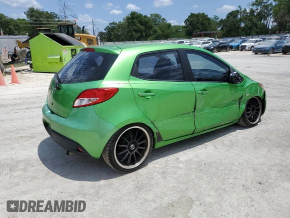 2012 Mazda 2 Sport with VIN JM1DE1KZ5C0141784, listed as a Copart auction lot 56498295 with 132,602 mi miles and Salvage Title. Bid and sale history available at DreamBid. Image 3.