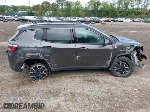 2020 Jeep Compass Trailhawk with VIN 3C4NJDDB3LT200268, listed as a IAAI auction lot 42250192 with 73,804 mi miles and . Bid and sale history available at DreamBid. Image 13.