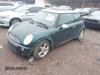 2006 MINI Hardtop with VIN WMWRC33506TK73564, listed as a IAAI auction lot 42602486 with 156,459 mi miles and . Bid and sale history available at DreamBid. Image 2.