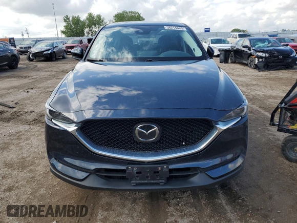 2021 Mazda CX-5 Grand Touring with VIN JM3KFBDM0M0500561, listed as a Copart auction lot 58214665 with 49,543 mi miles and Salvage title. Bid and sale history available at DreamBid. Image 5.