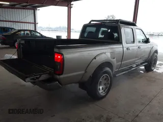 2003 Nissan Frontier SE z VIN 1N6ED29X73C438326, wystawiony jako IAAI lot #41437797 z przebiegiem 309 235 mil mil oraz . Historia ofert i sprzedaży dostępna na DreamBid. Obrazek 4.