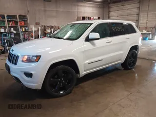 2015 Jeep Grand Cherokee Laredo with VIN 1C4RJFAG4FC660665, listed as a IAAI auction lot 41529532 with 124,099 mi miles. Bid and sale history available at carsss.com. Image 2.