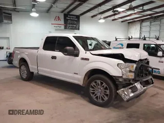 2015 Ford F-150 XL with VIN 1FTEX1CG5FKD31637, listed as a IAAI auction lot 41607827 with 201,278 mi miles. Bid and sale history available at carsss.com. Image 1.