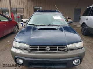 1997 Subaru Legacy Wagon Outback with VIN 4S3BG6854V7613017, listed as a IAAI auction lot 41574832 with 294,964 mi miles. Bid and sale history available at carsss.com. Image 6.
