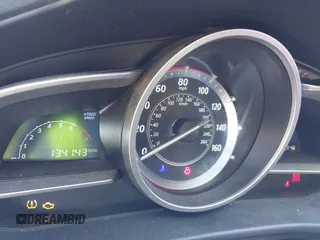 2015 Mazda 3 i SV with VIN JM1BM1T71F1218642, listed as a IAAI auction lot 42142795 with 134,143 mi miles. Bid and sale history available at carsss.com. Image 7.