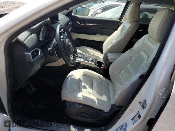 2021 Mazda CX-5 Grand Touring with VIN JM3KFBDM3M1305807, listed as a Copart auction lot 42713655 with 58,162 mi miles and Salvage Title. Bid and sale history available at DreamBid. Image 7.