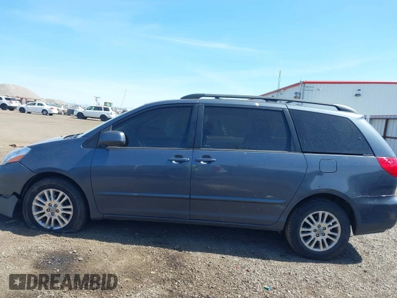2009 Toyota Sienna XLE with VIN 5TDBK22C69S027767, listed as a IAAI auction lot 42029832 with 200,752 mi miles and . Bid and sale history available at DreamBid. Image 14.