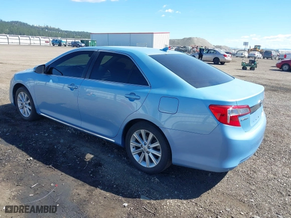 2014 Toyota Camry Hybrid LE with VIN 4T1BD1FK7EU098824, listed as a IAAI auction lot 42063119 with 112,759 mi miles. Bid and sale history available at carsss.com. Image 3.