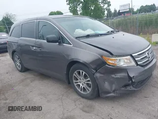 2011 Honda Odyssey EX-L with VIN 5FNRL5H64BB029087, listed as a IAAI auction lot 42508764 with 214,705 mi miles and . Bid and sale history available at DreamBid. Image 1.