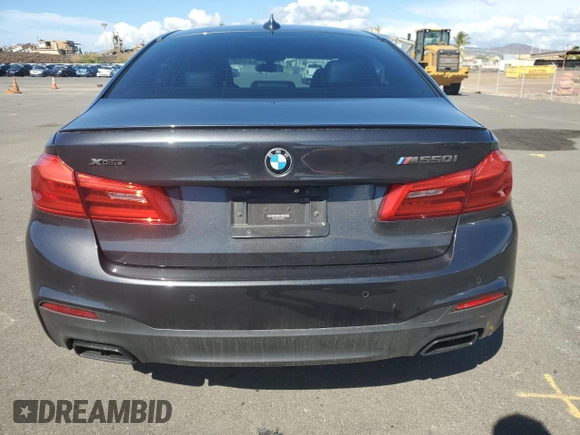 2019 BMW 5 Series M550i xDrive with VIN WBAJB9C57KB289036, listed as a Copart auction lot 86292134 with 28,103 mi miles and Salvage title. Bid and sale history available at DreamBid. Image 6.