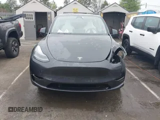 2025 Tesla Model Y Long Range with VIN 7SAYGDED8SA340082, listed as a IAAI auction lot 41915369 with 7,296 mi miles and . Bid and sale history available at carsss.com. Image 13.
