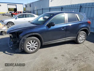 2015 Mazda CX-5 Sport with VIN JM3KE2BEXF0483141, listed as a Copart auction lot 59134105 with 71,727 mi miles and Salvage title. Bid and sale history available at DreamBid. Image 1.