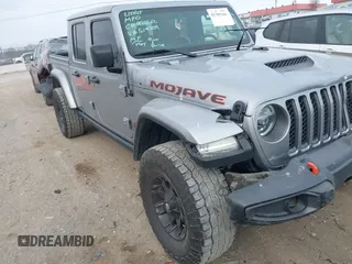 2021 Jeep Gladiator Mojave with VIN 1C6JJTEG9ML519309, listed as a IAAI auction lot 41701544 with 64,461 mi miles and . Bid and sale history available at DreamBid. Image 1.