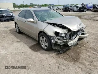 2006 Acura RL z VIN JH4KB16576C008162, wystawiony jako Copart lot #51801115 z przebiegiem Nie podano mil oraz Szkoda całkowita • Salvage title. Historia ofert i sprzedaży dostępna na DreamBid. Obrazek 11.