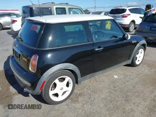 2002 MINI Hardtop with VIN WMWRC33402TC32985, listed as a IAAI auction lot 42608636 with 159,996 mi miles and . Bid and sale history available at DreamBid. Image 4.