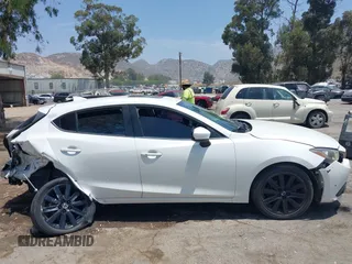 2016 Mazda 3 i Grand Touring with VIN JM1BM1N71G1283330, listed as a IAAI auction lot 42493686 with 148,032 mi miles and . Bid and sale history available at DreamBid. Image 13.